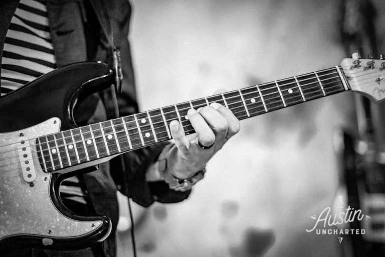 Adam Zuniga holding guitar