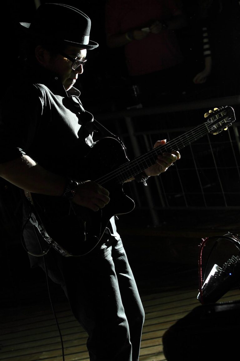 Adam performing before an audience.